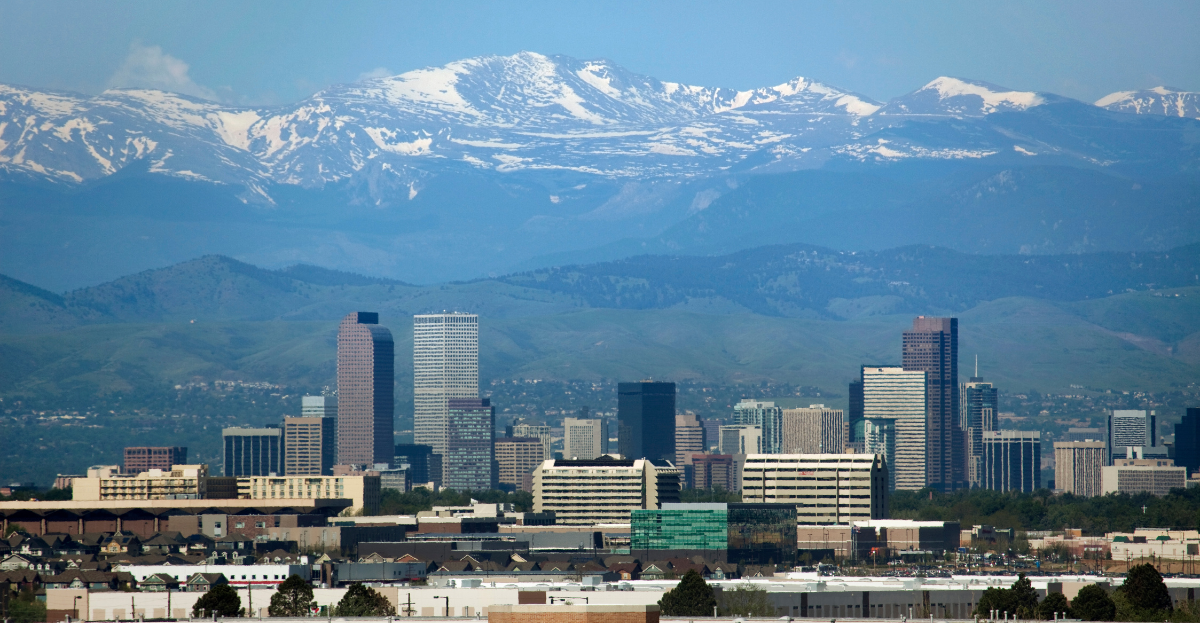 A city with snow covered mountains.